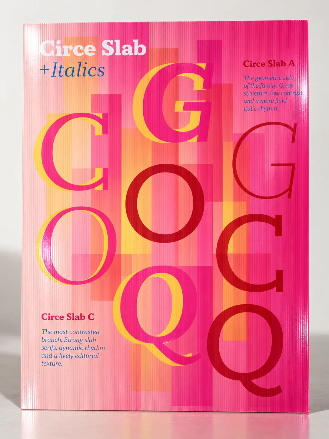 A poster on ribbed stock: C, G, O and Q overlapping in magenta, red and amber, with notes on the two branches of the family