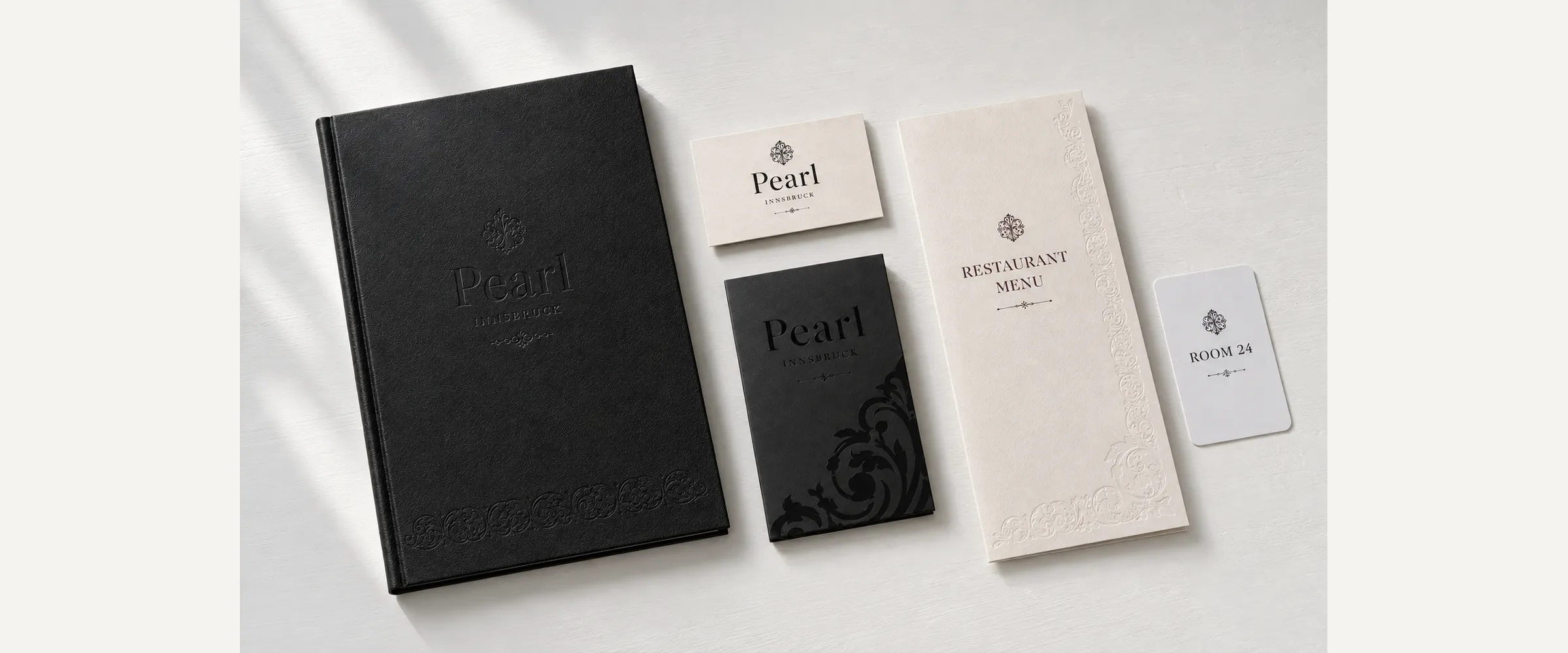 Pearl Innsbruck: guest folder, restaurant menu and key card